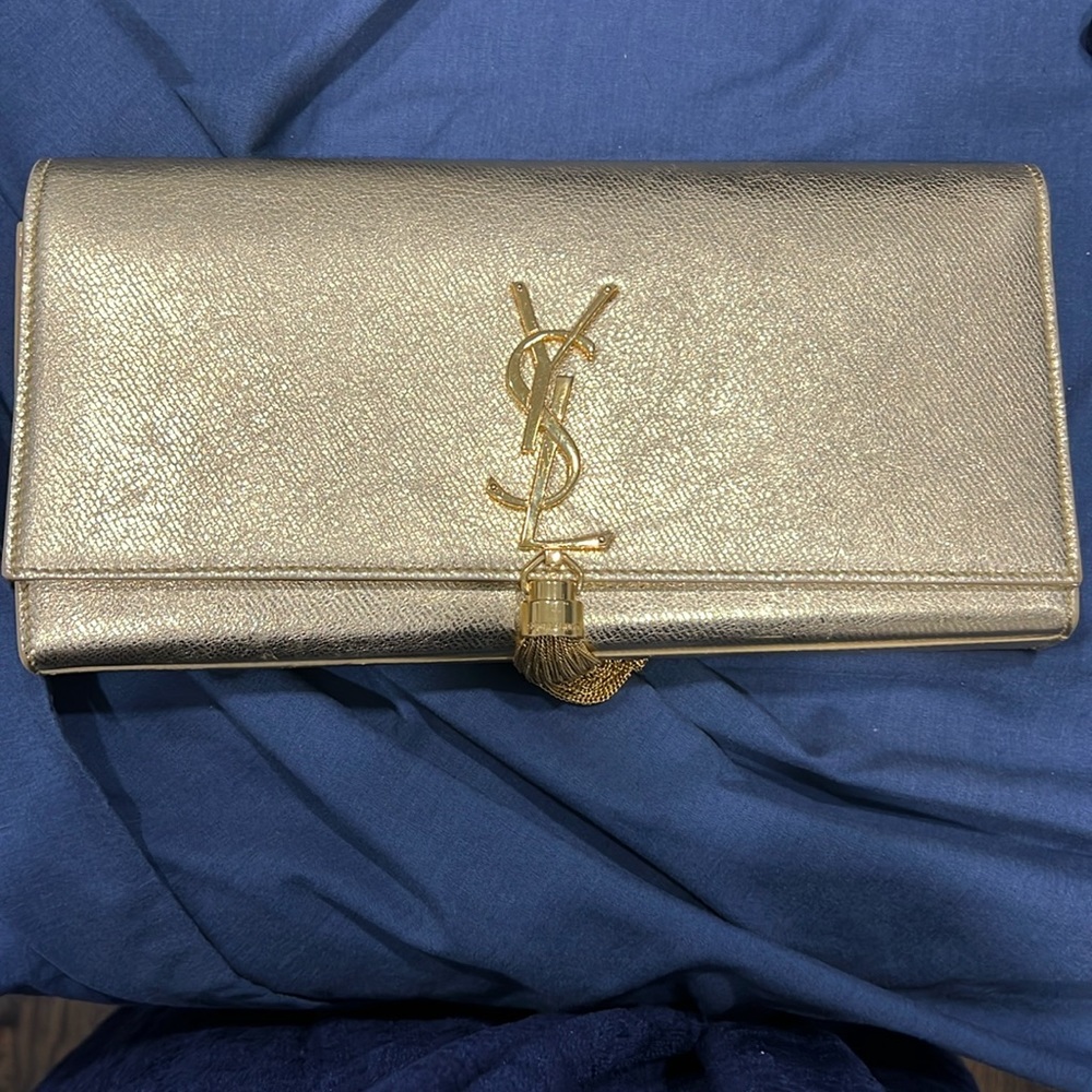 Gold Yves Saint Laurent tassel clutch